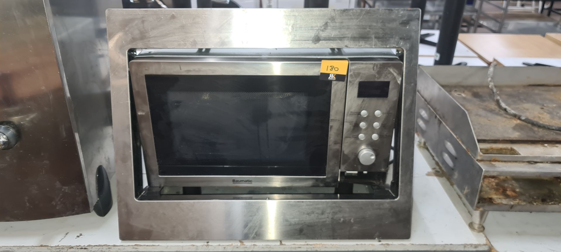 Baumatic microwave with detachable surround for integrating into cupboards NB. Damaged "Open" button