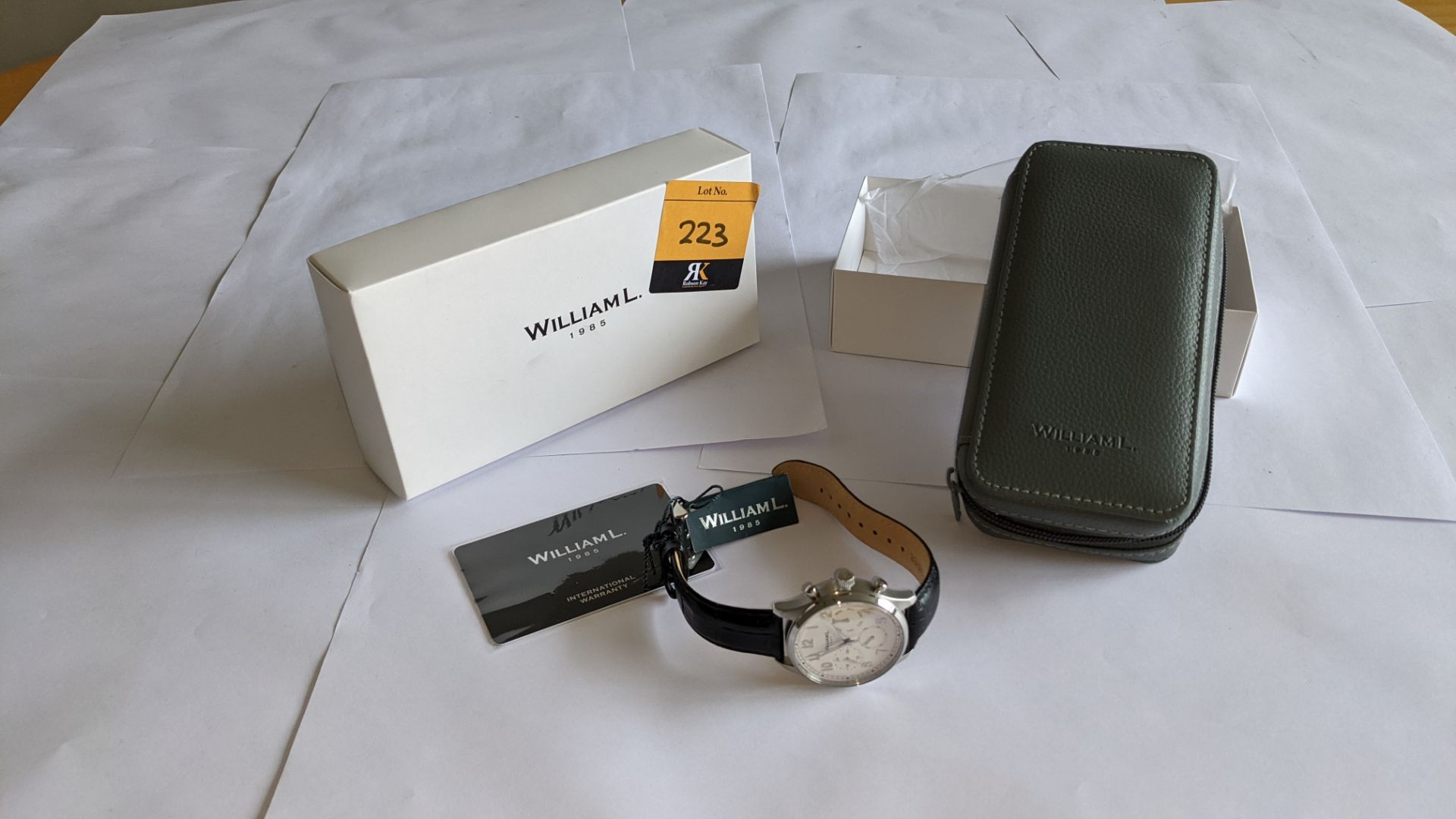 William L 1985 stainless steel watch, 5 ATM water resistant, leather strap, RRP £129. Includes box