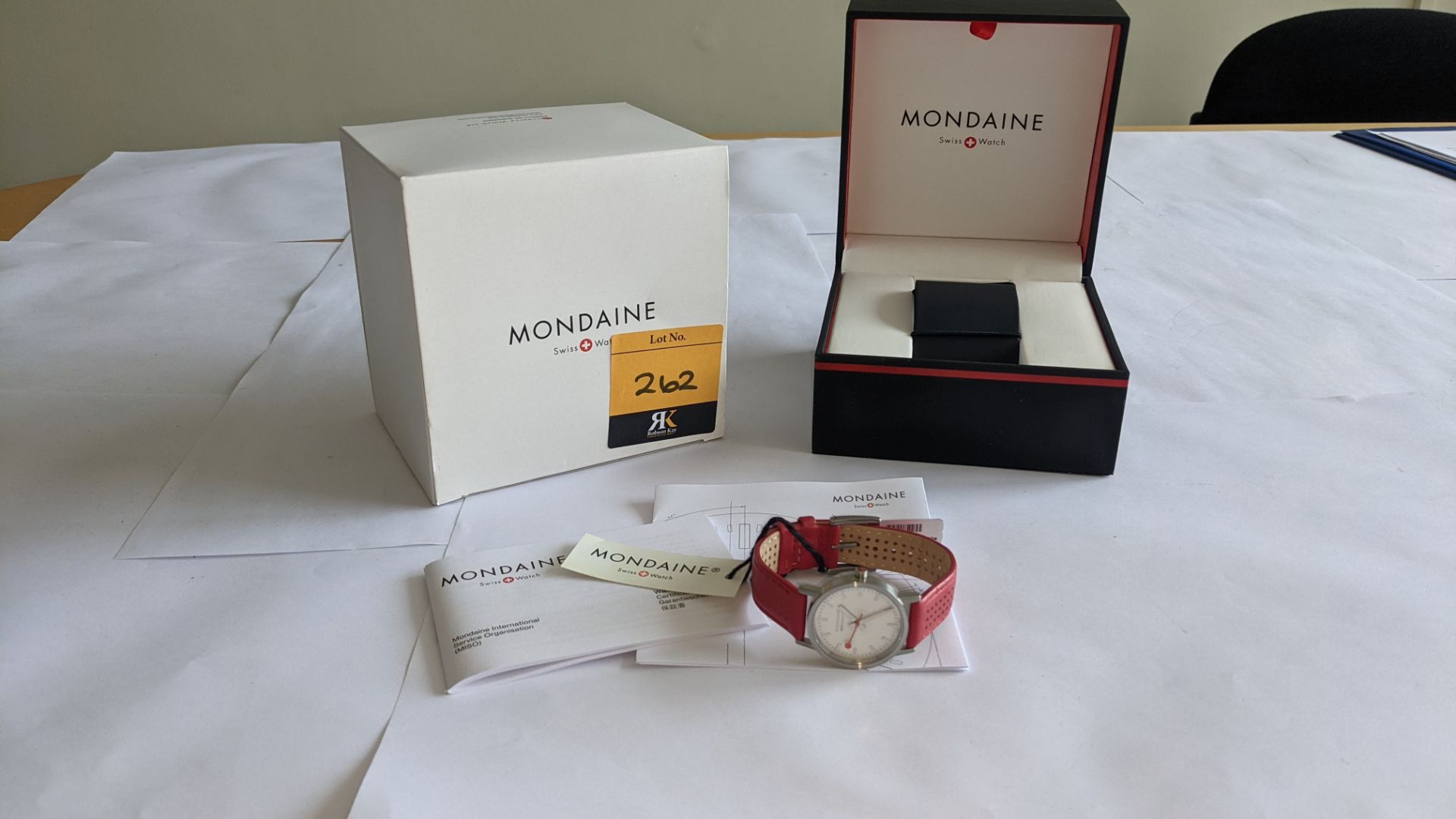 Mondaine watch on red leather strap. Product code A658.30323.16SBC. Water resistant, stainless steel