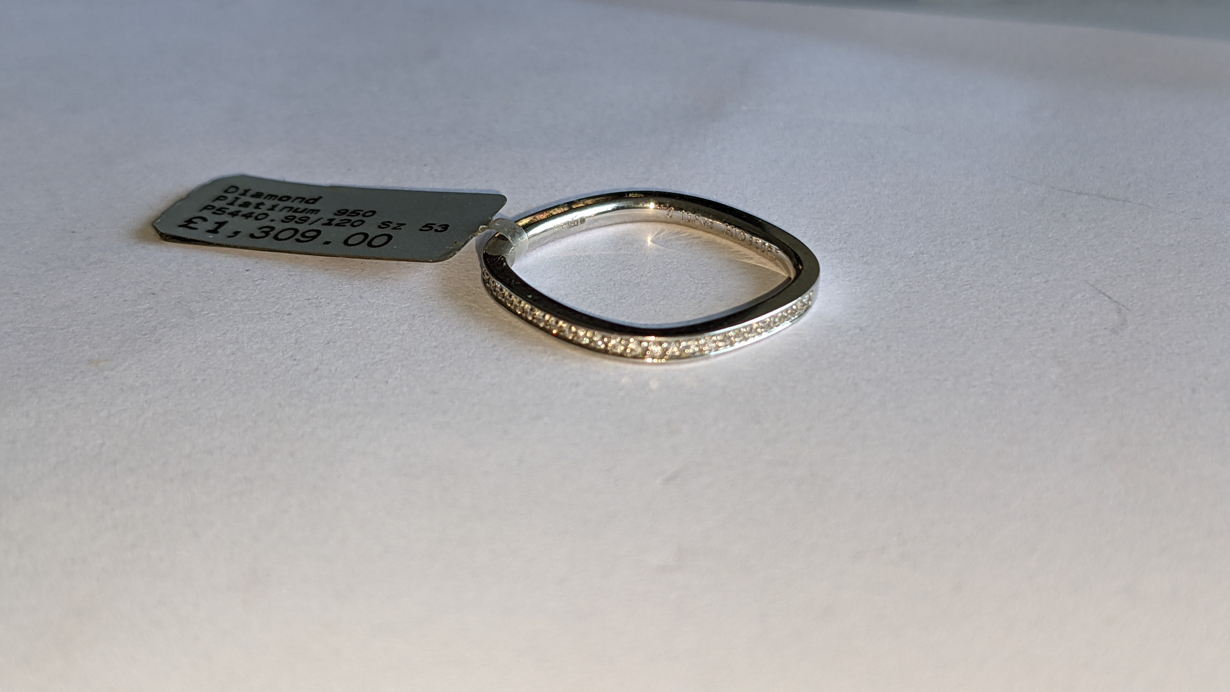 Platinum 950 ring with 0.13ct total weight of F/VS brilliant cut channel set diamonds. RRP £1,309 - Image 7 of 14