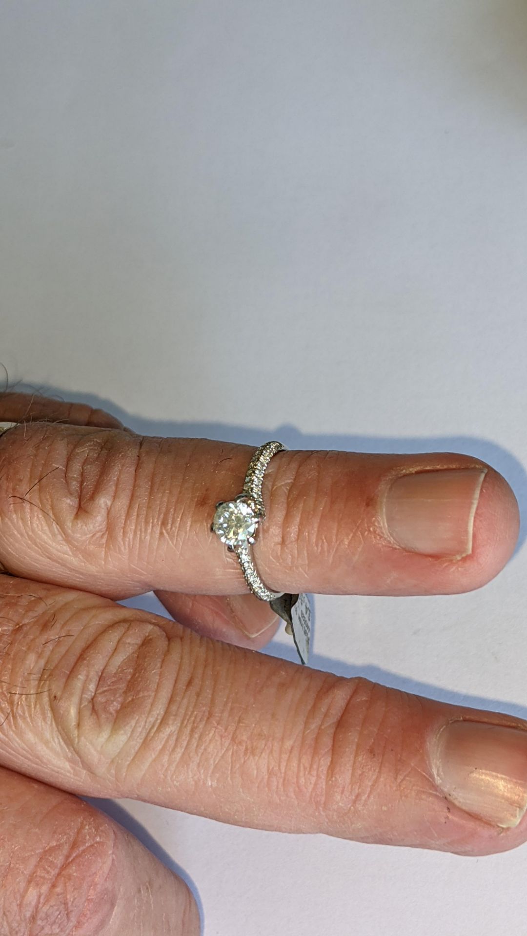 Platinum 950 diamond ring with 0.55ct central stone & 0.348ct of smaller stones on the shoulders. RR - Image 14 of 16