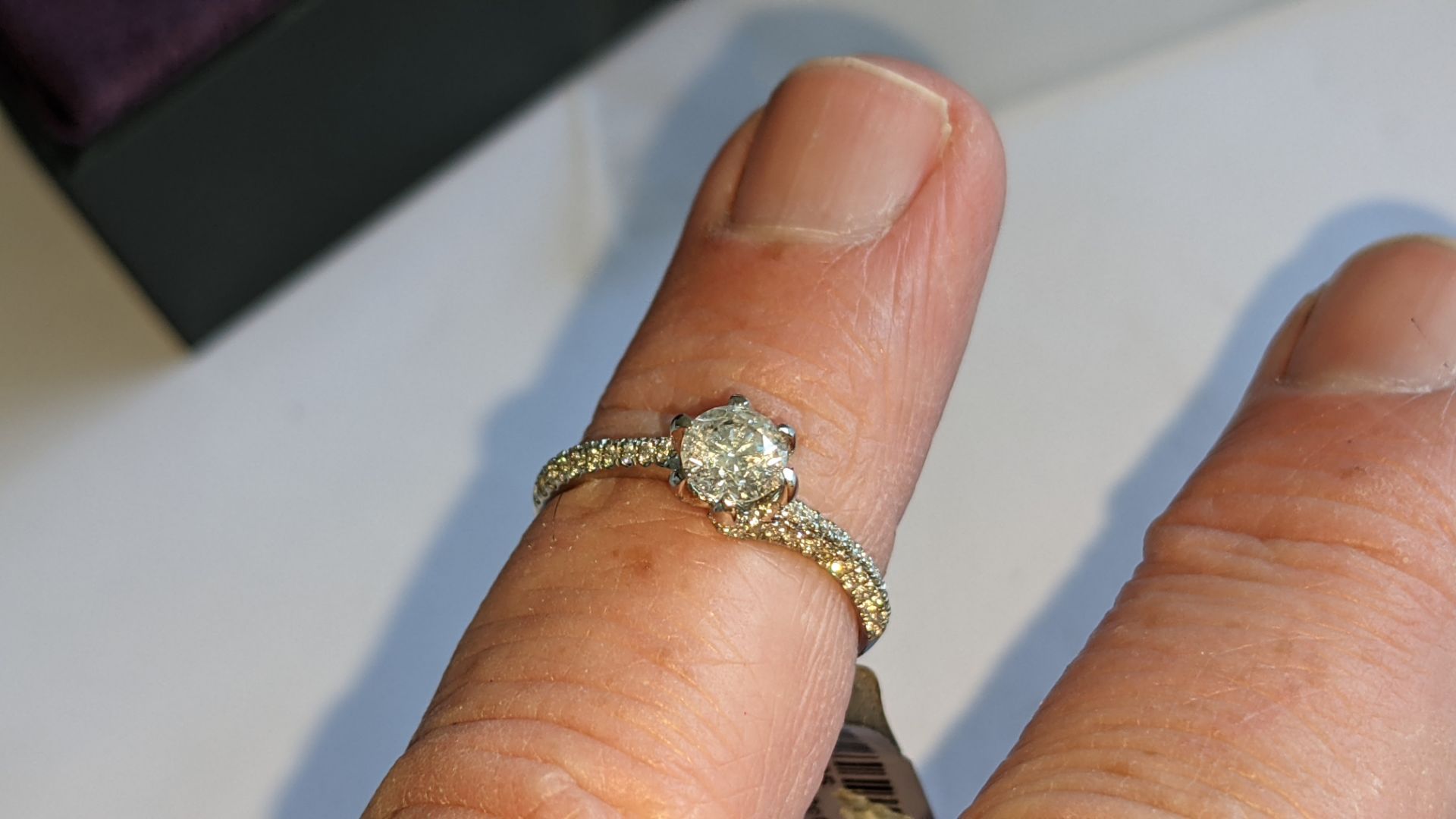 Platinum 950 diamond ring with 0.55ct central stone & 0.348ct of smaller stones on the shoulders. RR - Image 12 of 16