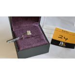 18ct white gold ring with 0.69ct of baguette & round diamonds. Includes certificate that relates to