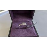 Diamond & 18ct white gold ring with centre stone flanked by 2 smaller stones all in baguette type cu