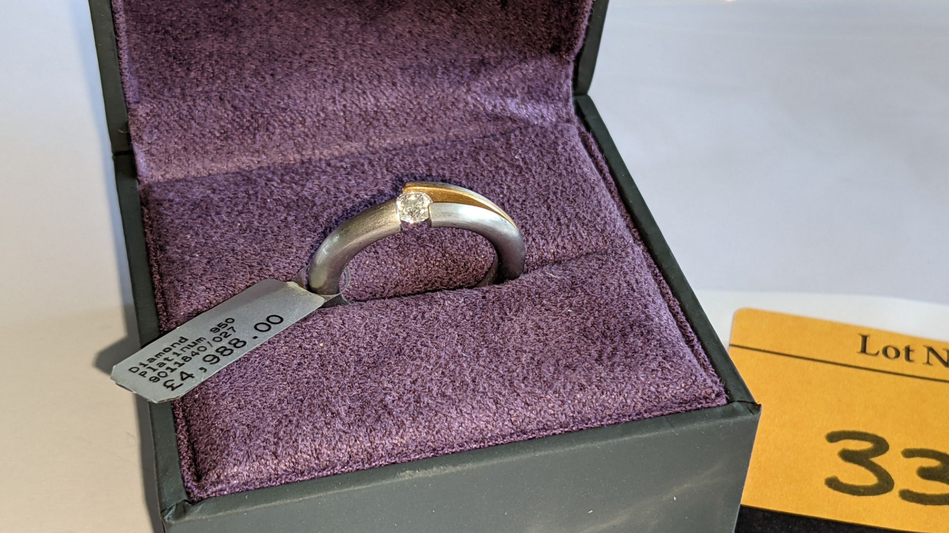 Platinum 950 ring with central diamond weighing 0.27ct & rose gold finish to small area of the mount