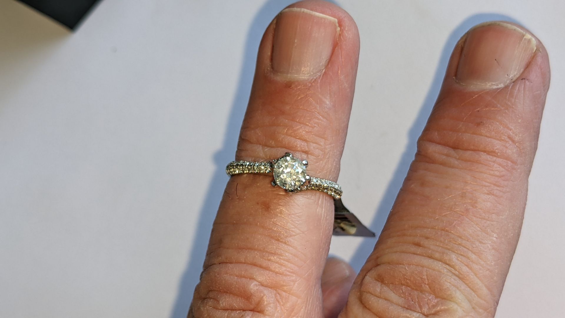 Platinum 950 diamond ring with 0.55ct central stone & 0.348ct of smaller stones on the shoulders. RR - Image 13 of 16