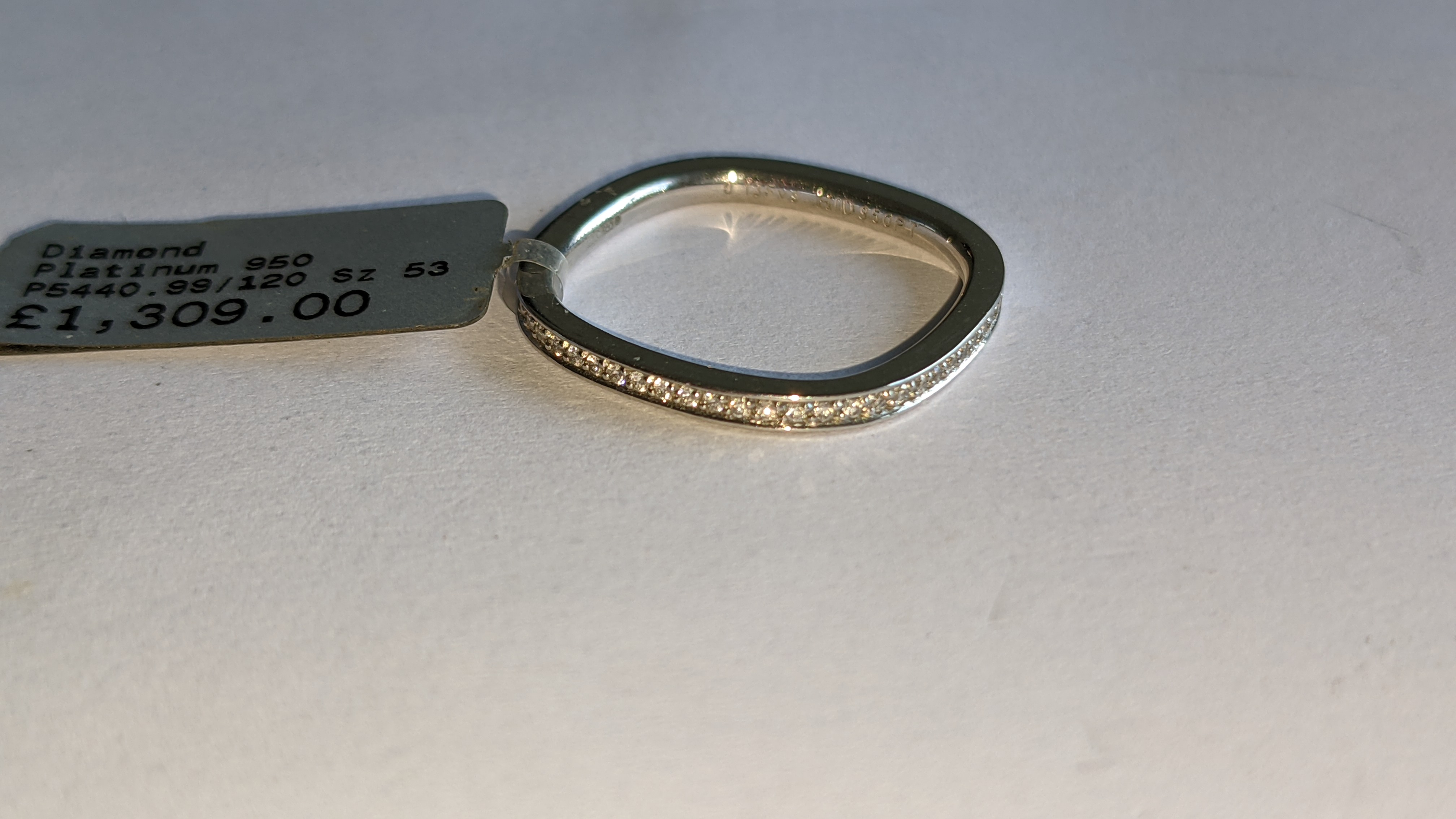 Platinum 950 ring with 0.13ct total weight of F/VS brilliant cut channel set diamonds. RRP £1,309 - Image 6 of 14