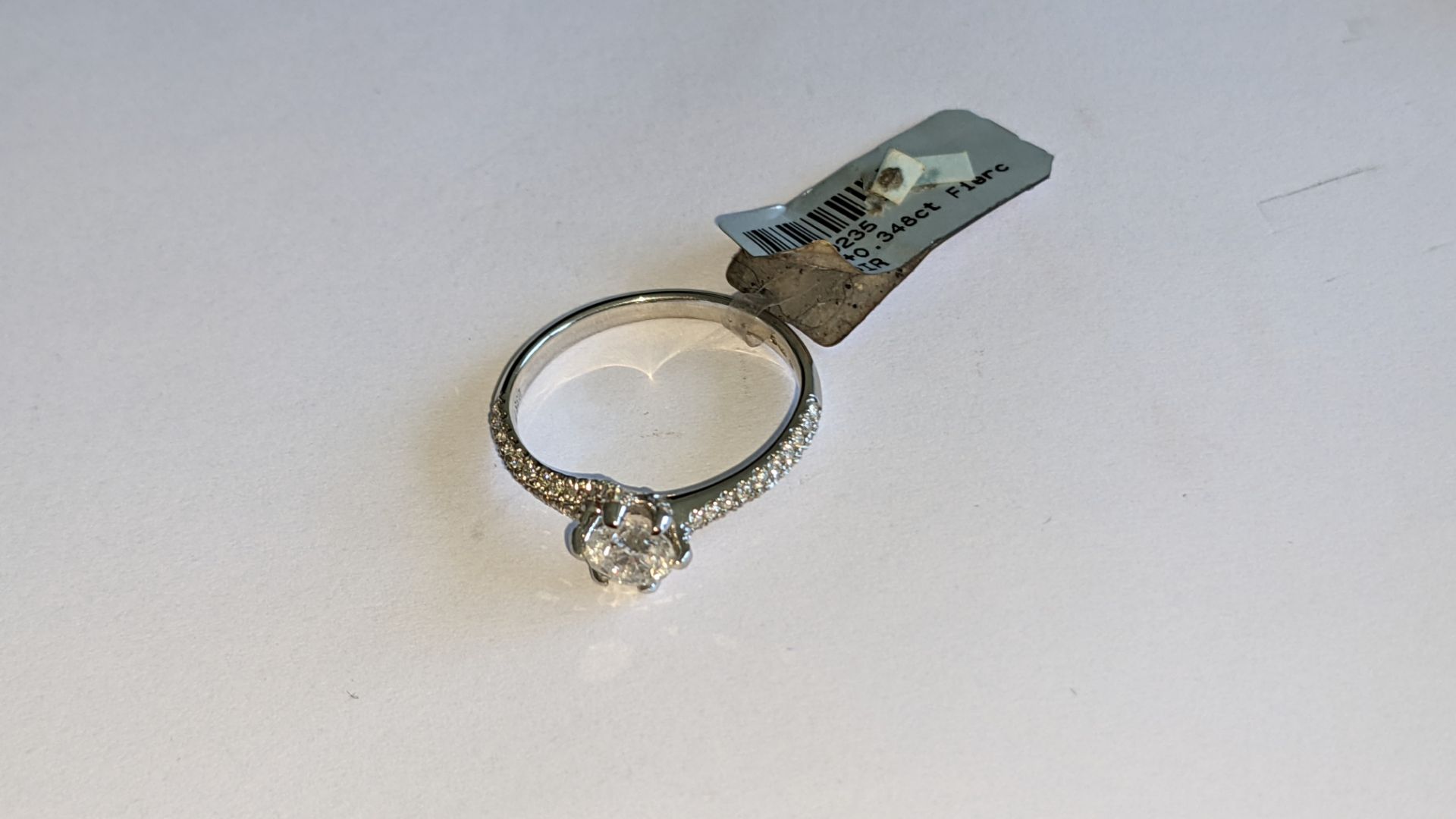 Platinum 950 diamond ring with 0.55ct central stone & 0.348ct of smaller stones on the shoulders. RR - Image 8 of 16