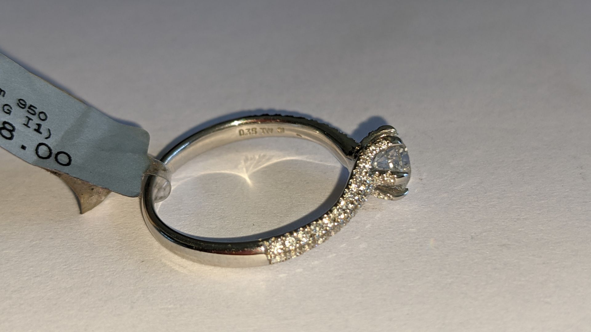 Platinum 950 diamond ring with 0.55ct central stone & 0.348ct of smaller stones on the shoulders. RR - Image 10 of 16