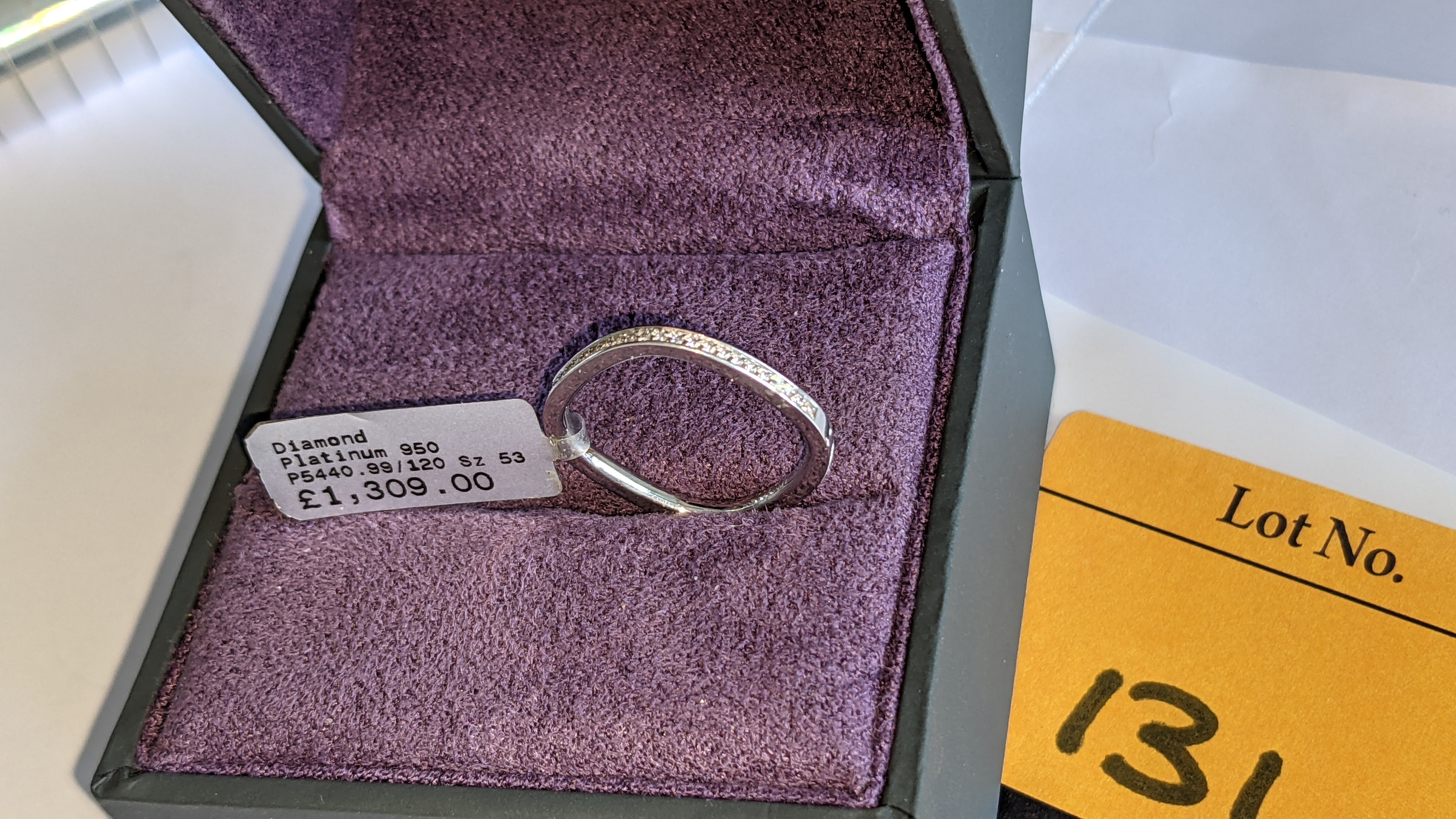 Platinum 950 ring with 0.13ct total weight of F/VS brilliant cut channel set diamonds. RRP £1,309 - Image 5 of 14