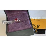 18ct white gold ring with central ruby & 0.27ct diamonds around the ruby & on each shoulder. RRP £2