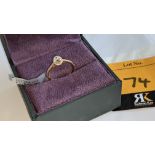 18ct rose gold ring with 0.40ct central stone & 0.43ct of additional stones around the central stone