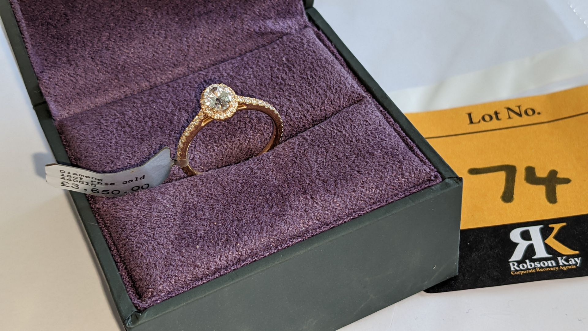 18ct rose gold ring with 0.40ct central stone & 0.43ct of additional stones around the central stone