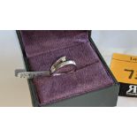 18ct white gold ring with central diamond weighing 0.07ct. RRP £1,024