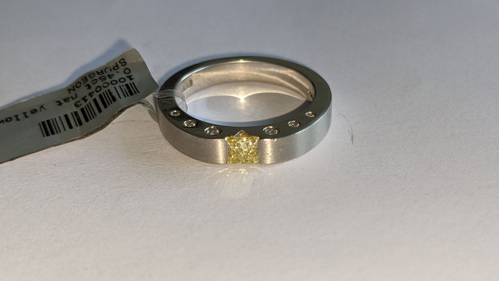 Platinum 950 diamond ring which has 6 white stones on either side of the shoulders & one larger yell - Image 6 of 15