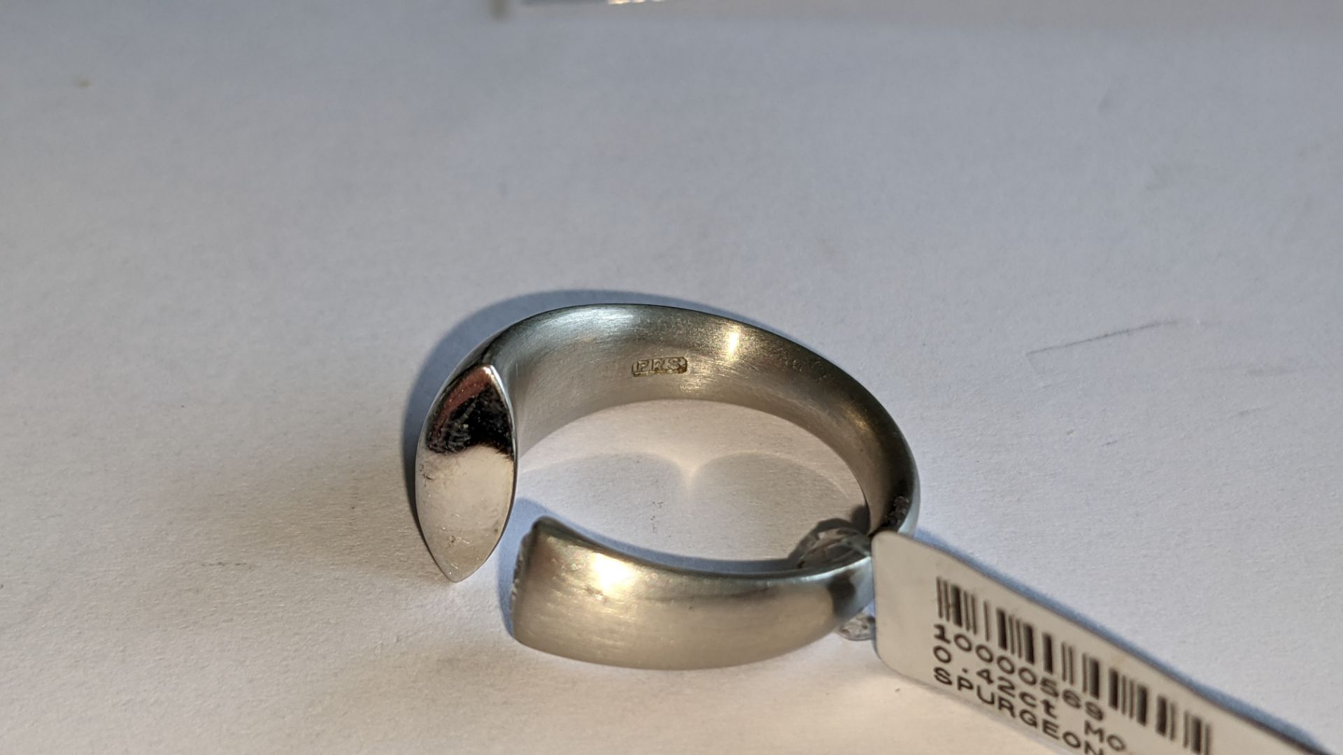 Modern ring in platinum 950 with 0.42ct stone at one end of unusual modern design. RRP £5,786 - Image 14 of 19