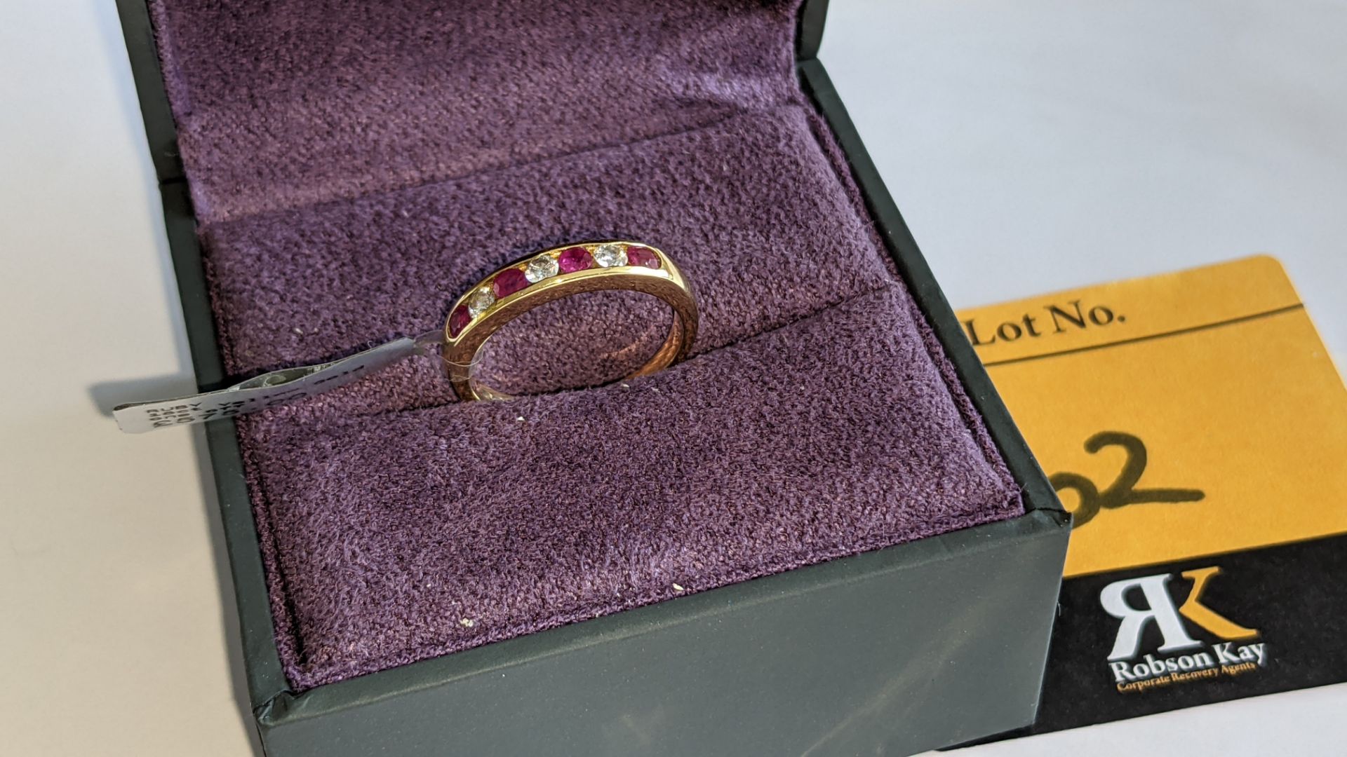 18ct yellow gold ring with rubies & what are assumed to be diamonds. RRP £575