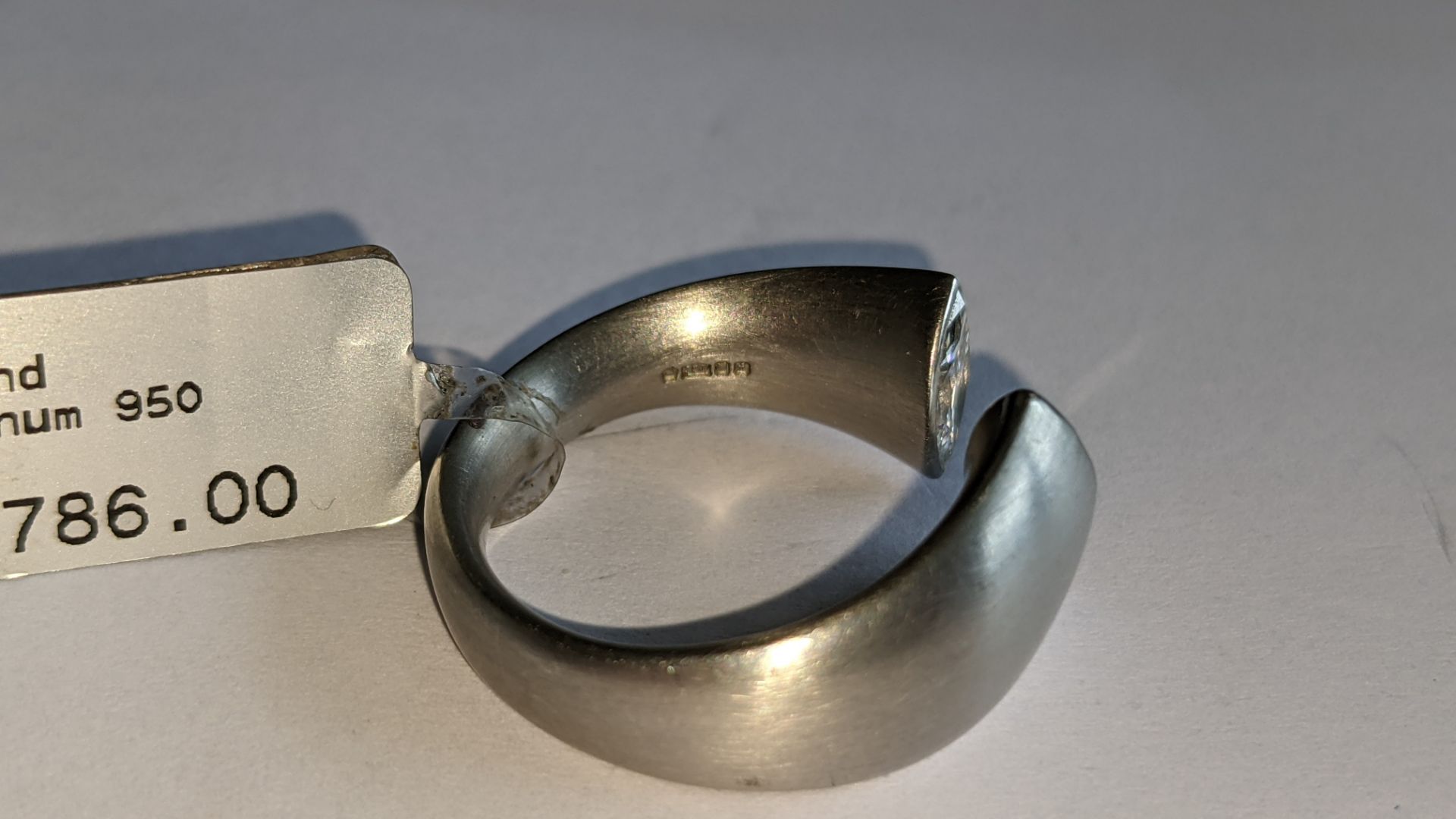 Modern ring in platinum 950 with 0.42ct stone at one end of unusual modern design. RRP £5,786 - Image 12 of 19