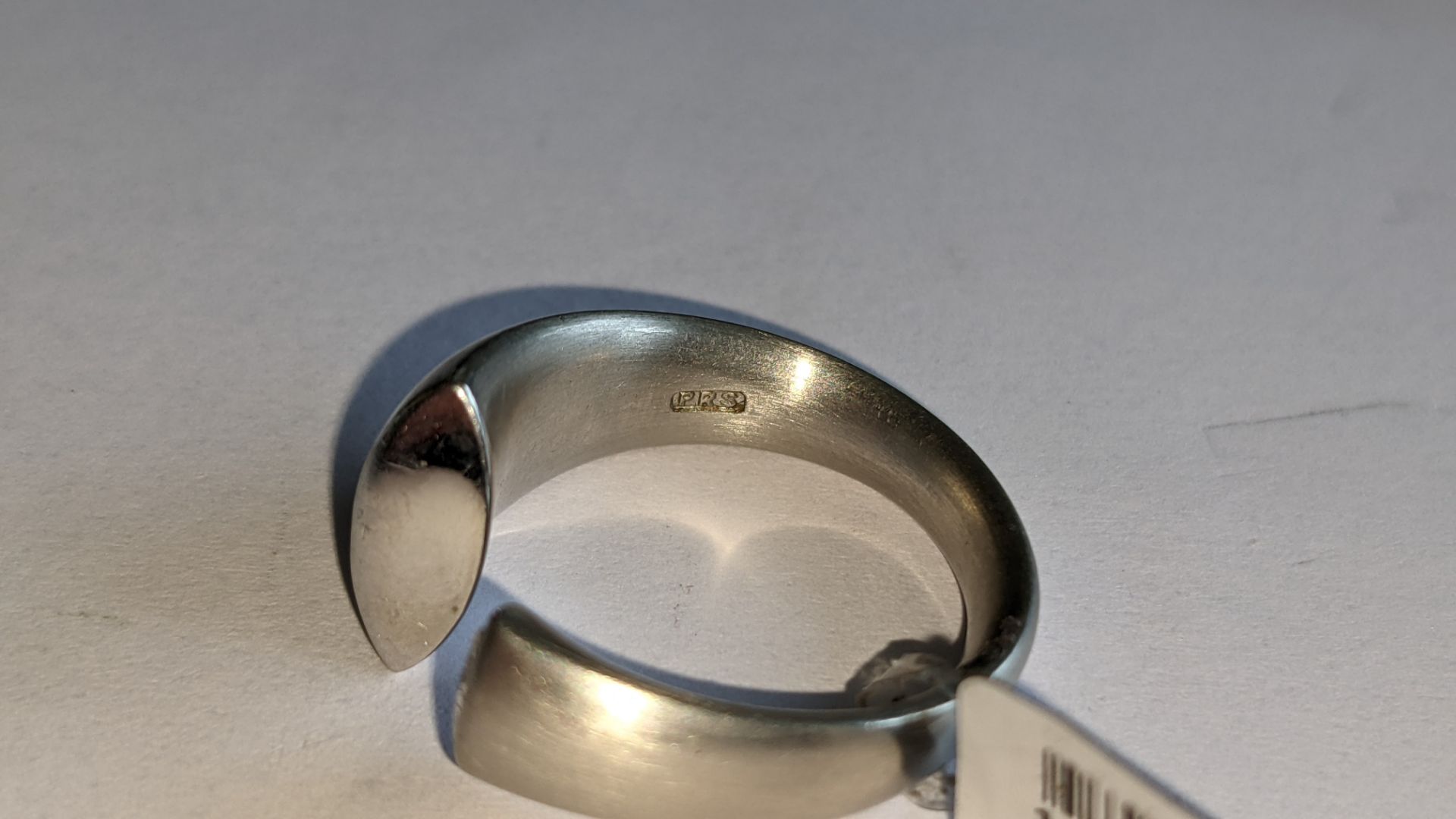 Modern ring in platinum 950 with 0.42ct stone at one end of unusual modern design. RRP £5,786 - Image 13 of 19