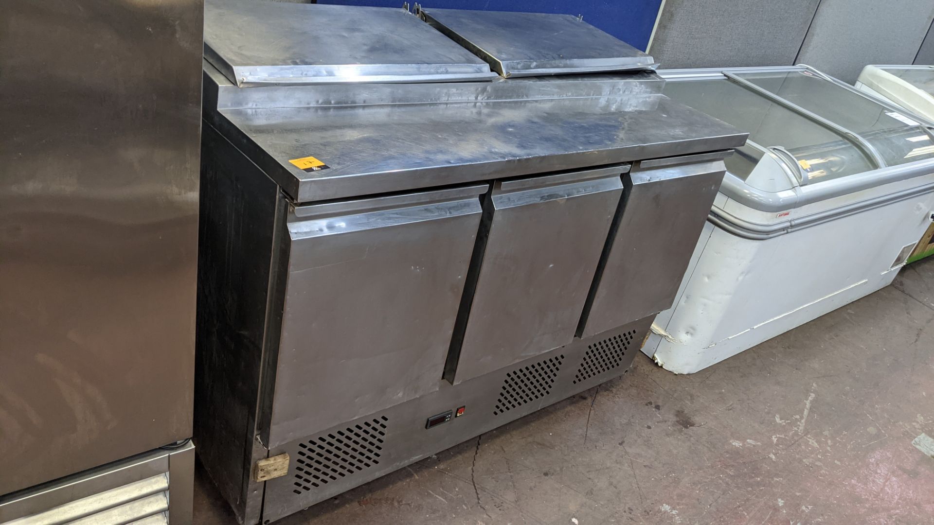 Empire, model P5300, stainless steel mobile refrigerated prep cabinet with 3 doors across the front