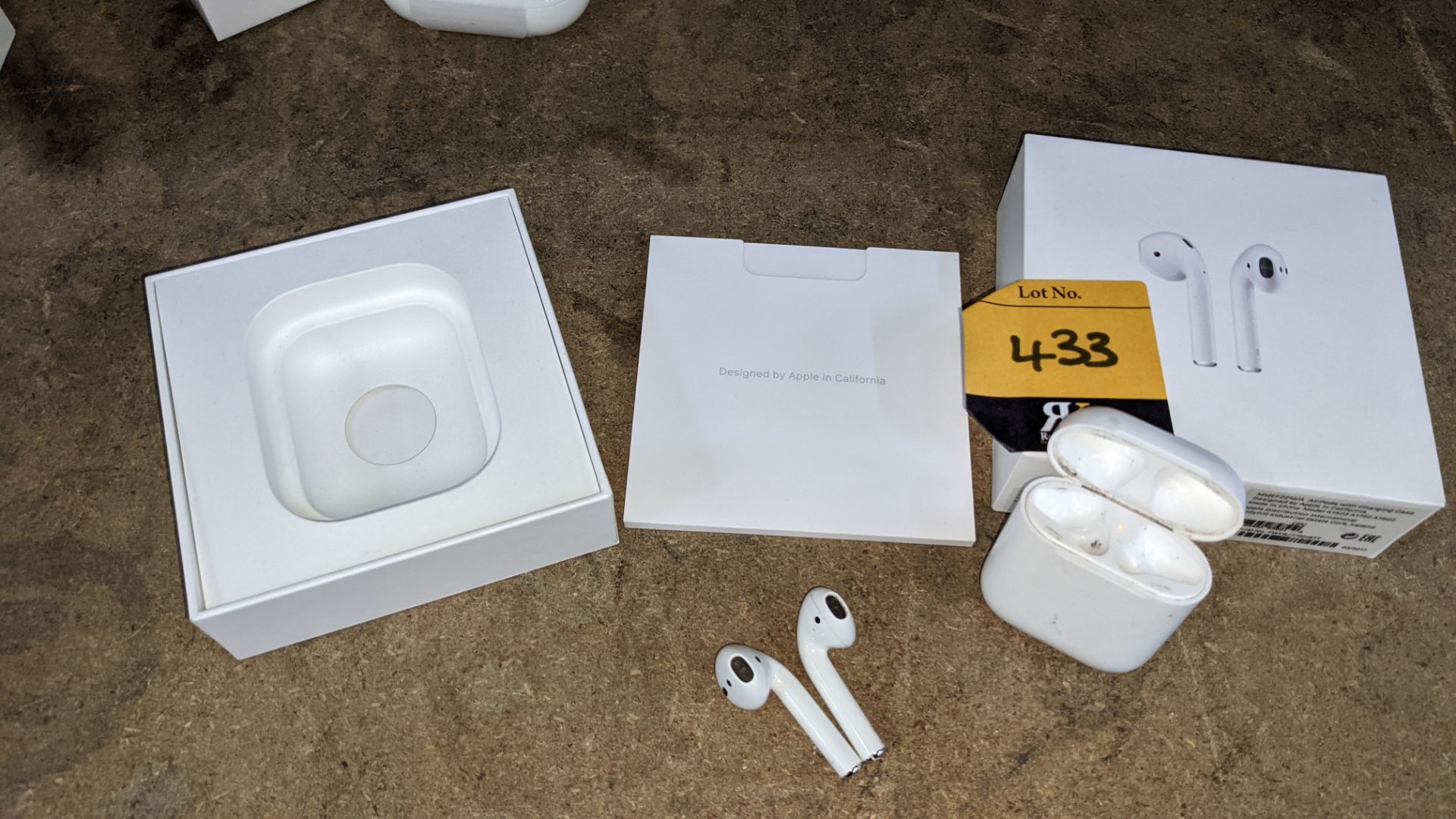 Apple AirPods with charging case, box & book pack