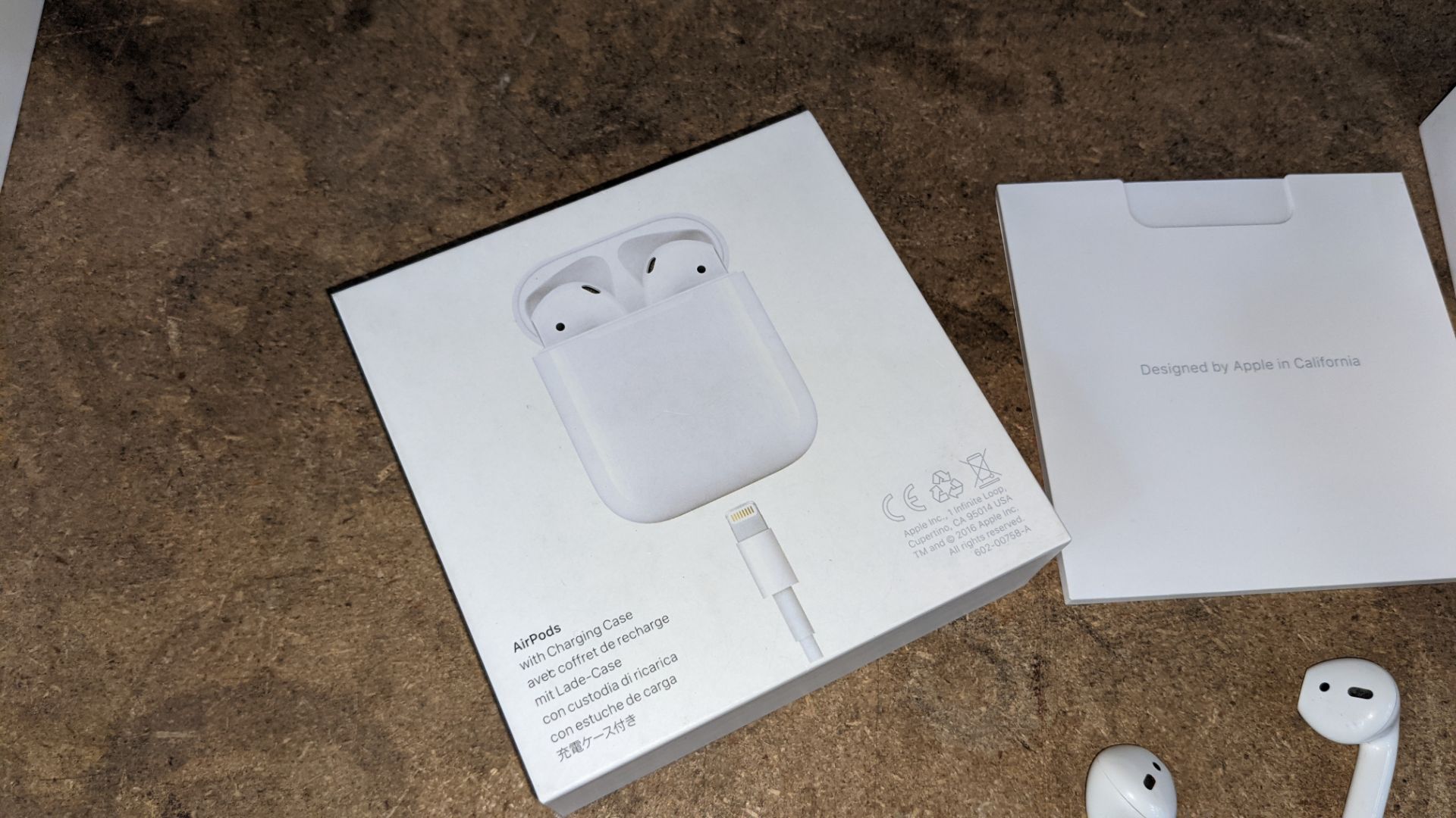 Apple AirPods with charging case, box & book pack - Image 10 of 15