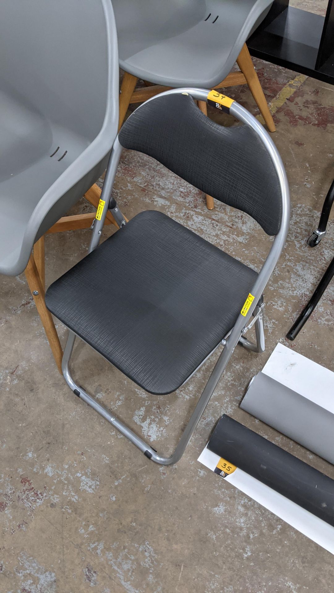 Grey folding upholstered chair - Image 2 of 2