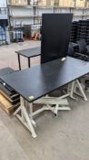 Pair of height adjustable tables each comprising black laminated top measuring 1600mm x 800mm on hea