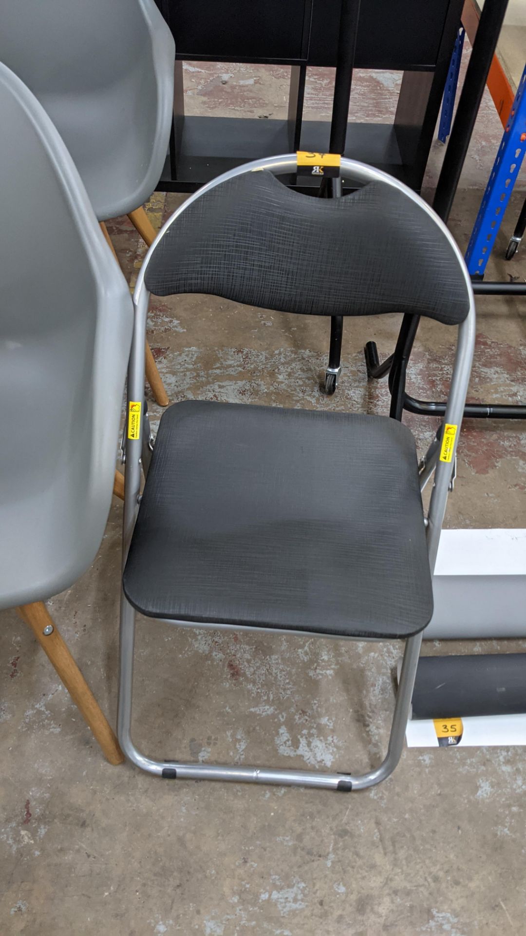 Grey folding upholstered chair