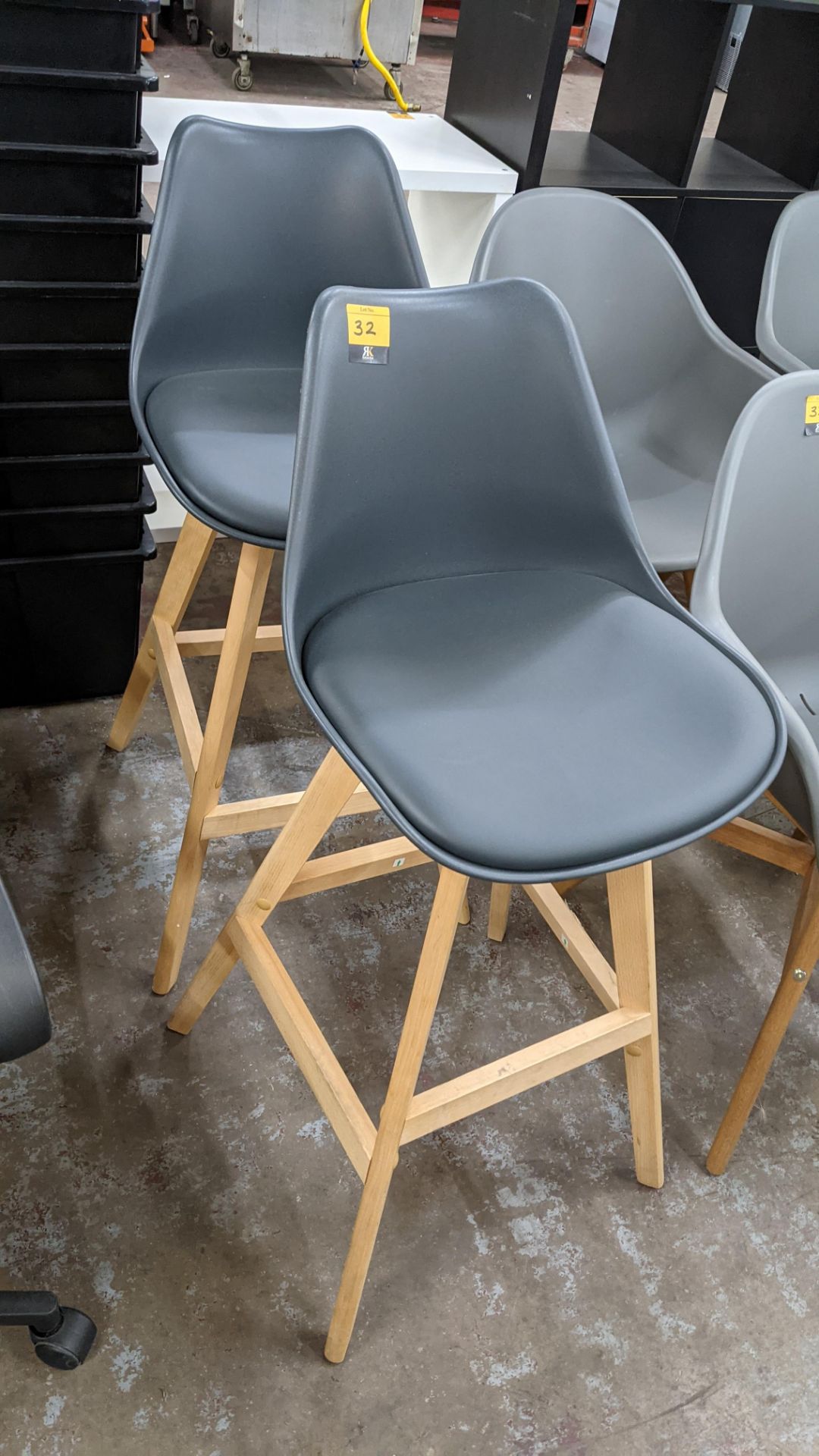 Pair of matching high backed stools each comprising wooden frame with dark grey plastic seat & padde