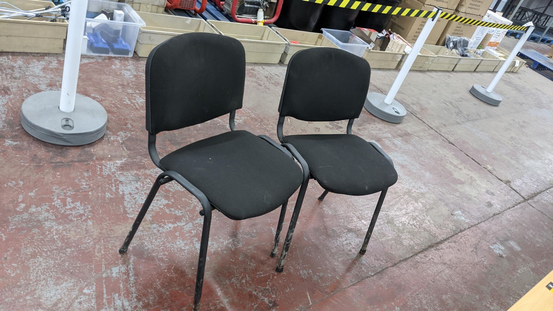 Pair of matching, stacking black upholstered stand chairs