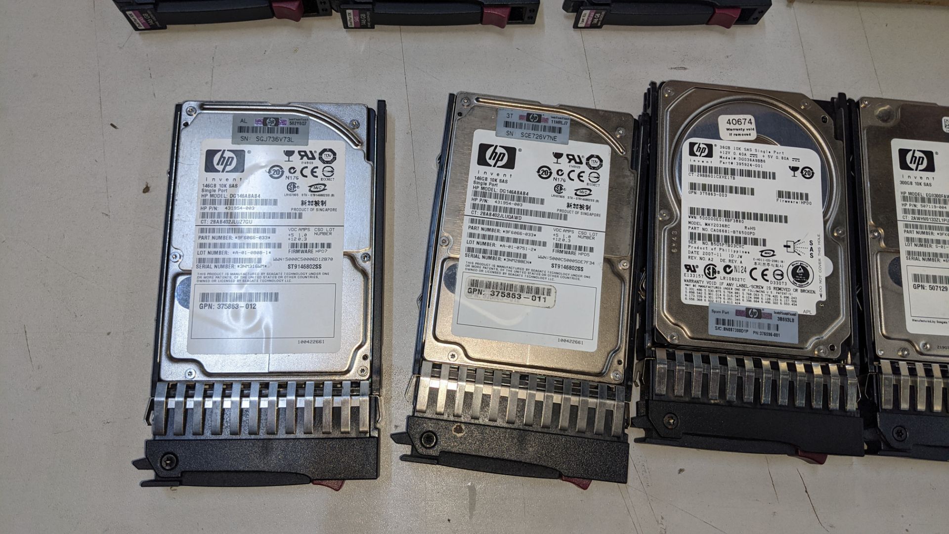 12 off assorted server hard drives comprising 1 off 300GB SSD drive, 1 off 500GB hard drive, 1 off 3 - Image 6 of 9