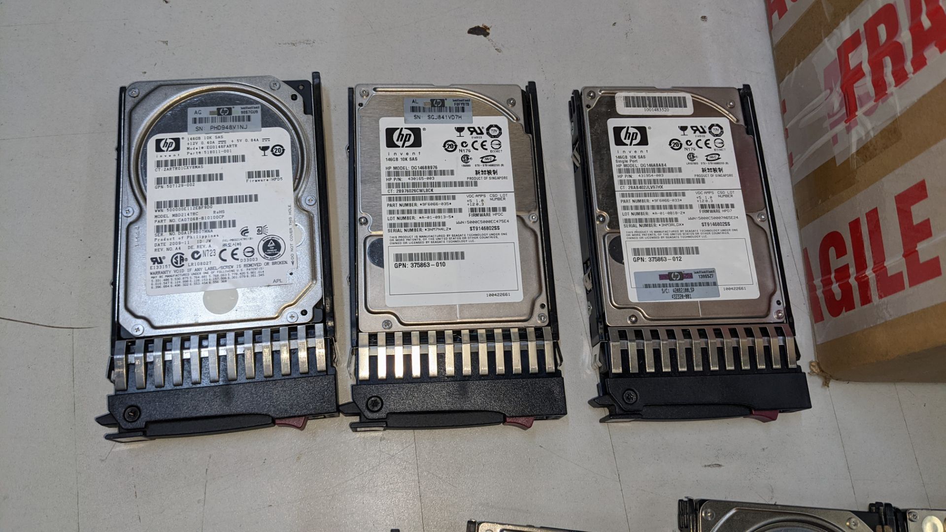 12 off assorted server hard drives comprising 1 off 300GB SSD drive, 1 off 500GB hard drive, 1 off 3 - Image 7 of 9