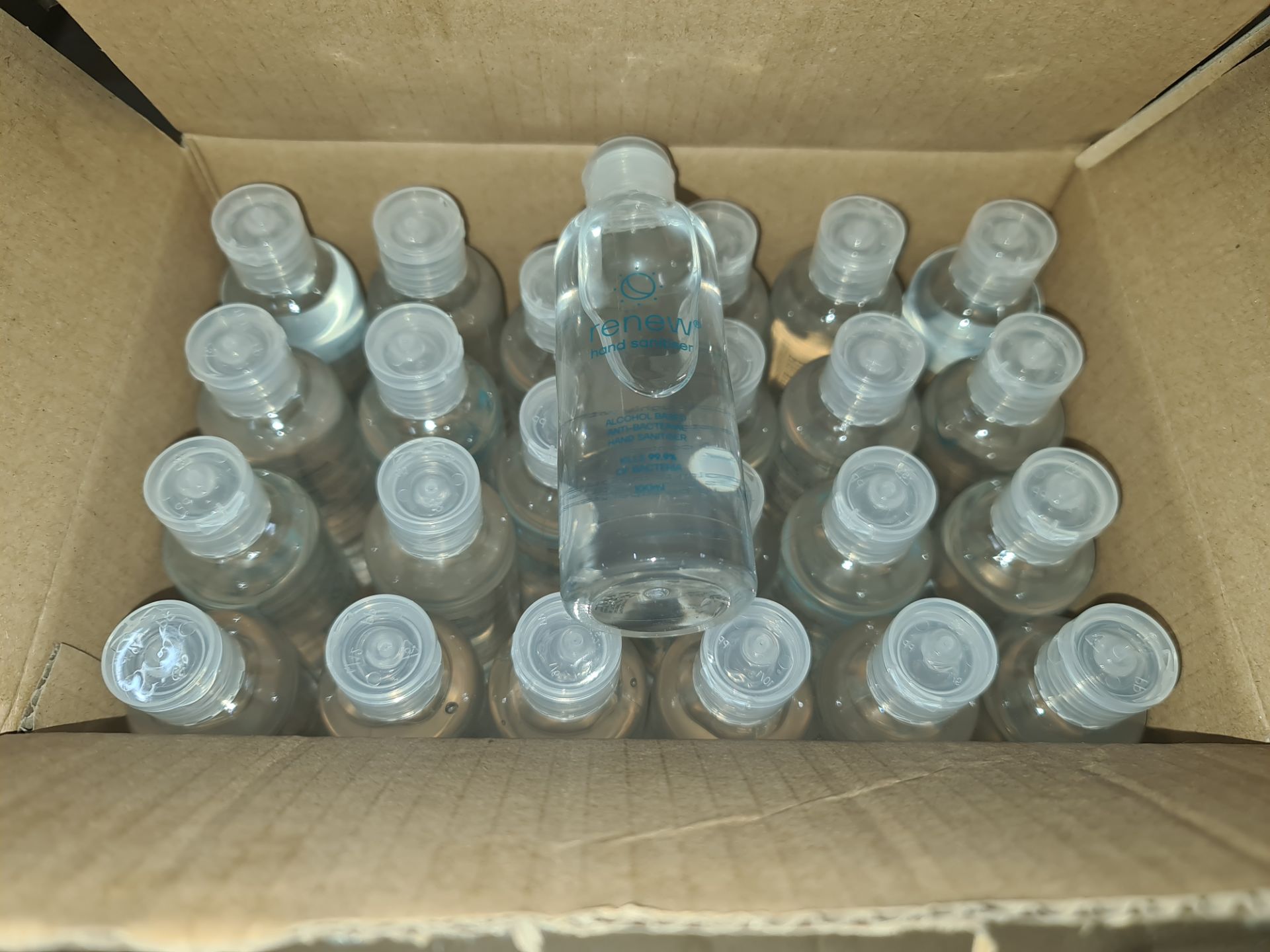 1 box containing a total of 144 travel size bottles of alcohol based hand sanitiser. Each bottle is