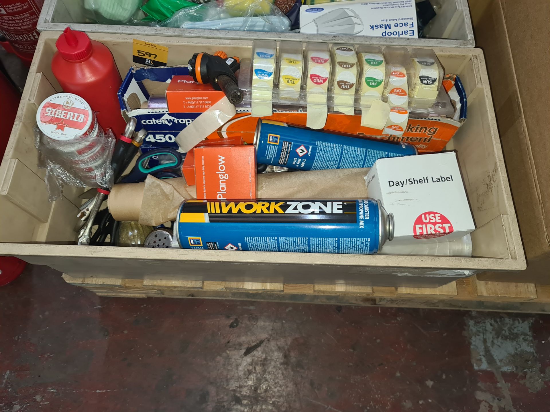 Contents of a crate including Day stickers, catering wrap, blowtorch & canisters for use with same,