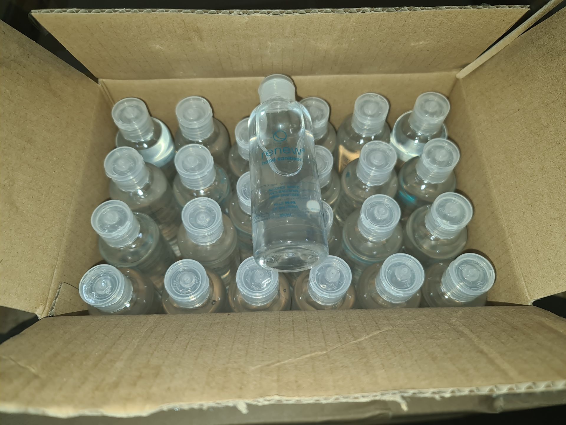3 boxes containing a total of 432 travel size bottles of alcohol based hand sanitiser. Each bottle i