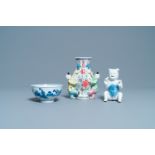 A Chinese blue and white bowl, a figure of a boy and a famille rose wall vase, Kangxi/Qianlong