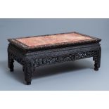 A Chinese mother-of-pearl-inlaid wooden low side table with marble top, 19th C.