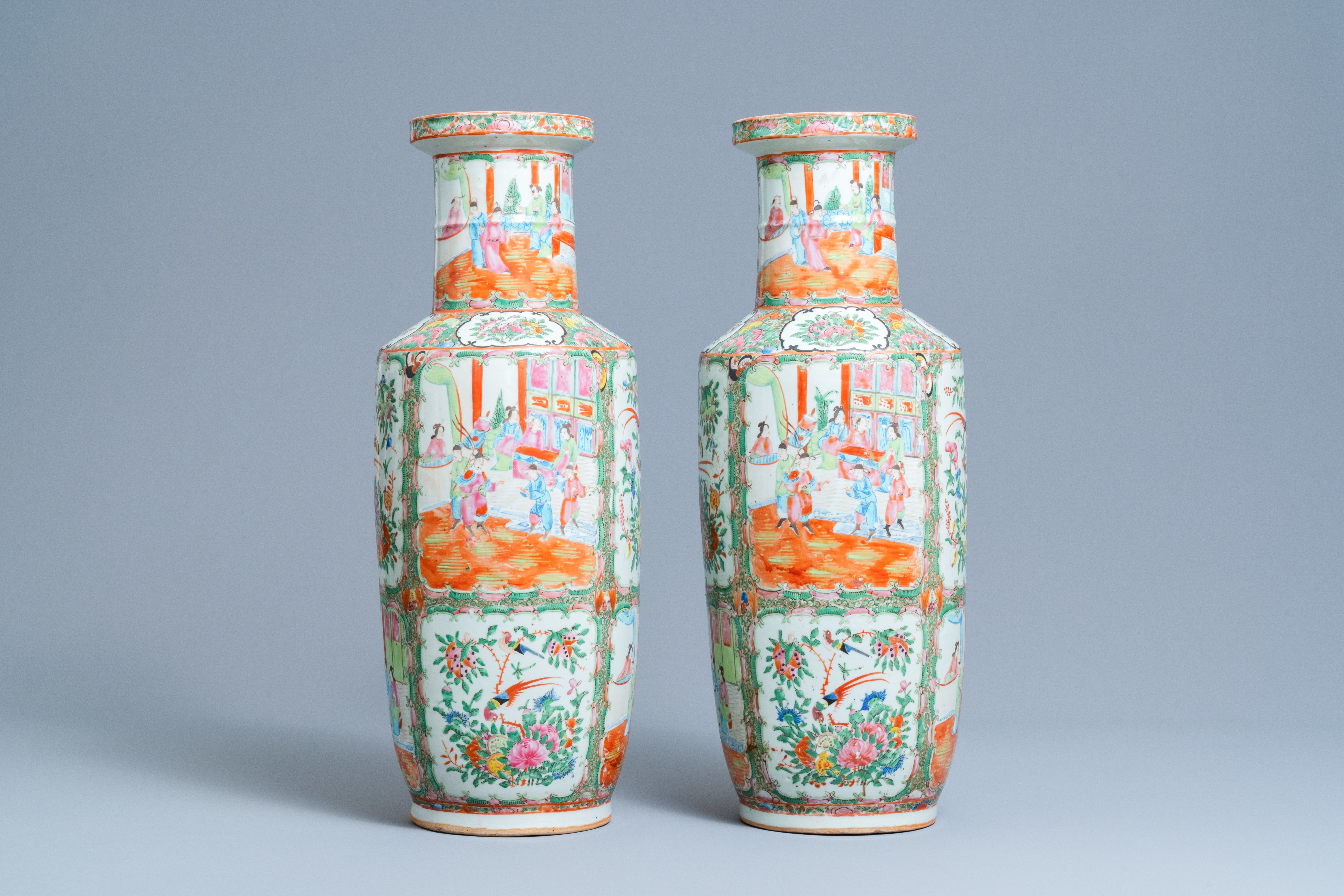 A pair of Chinese Canton famille rose rouleau vases, 19th C.