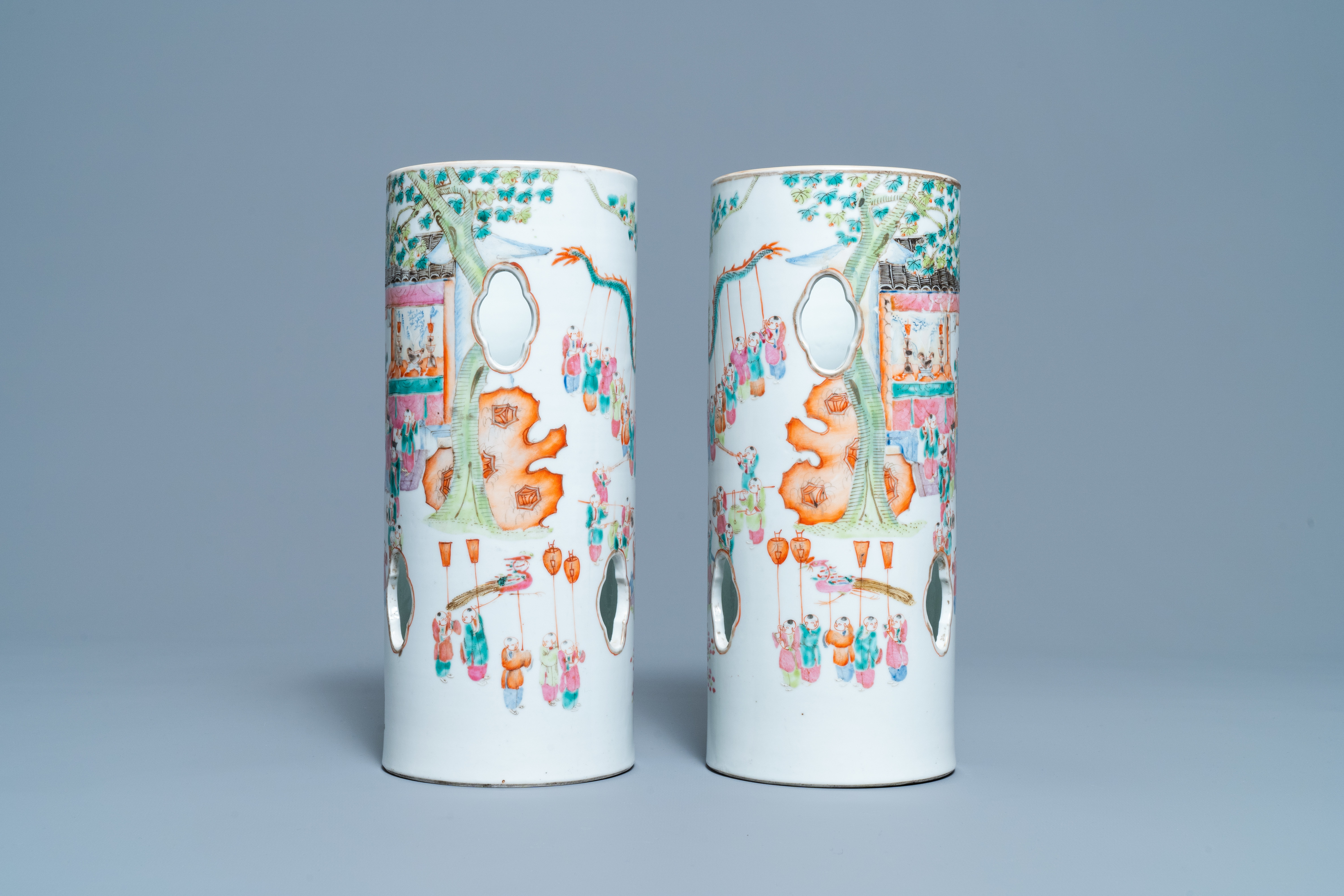 A pair of reticulated Chinese famille rose '100 boys' hat stands, Qianlong mark, 19th C. - Image 4 of 6