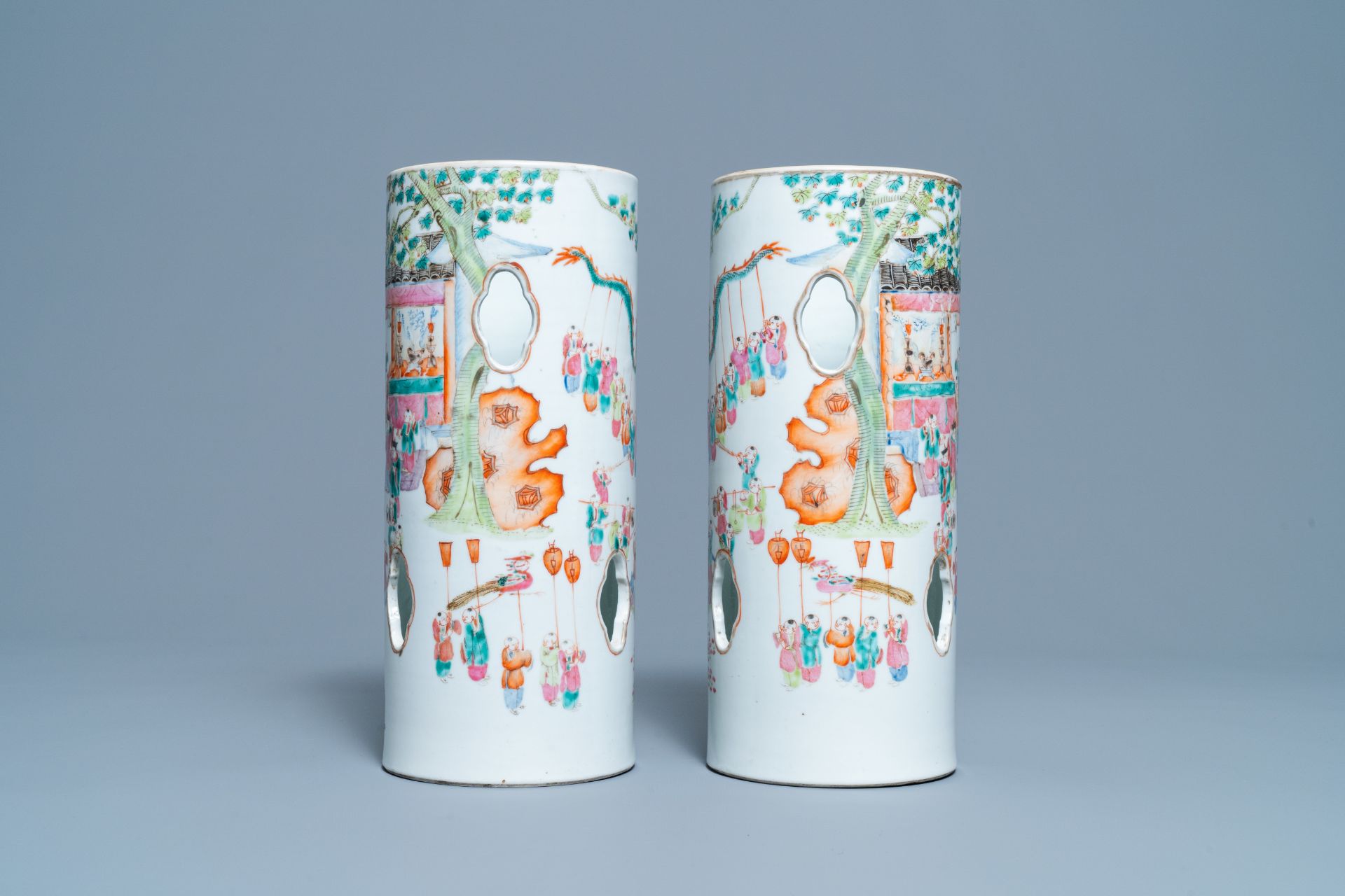 A pair of reticulated Chinese famille rose '100 boys' hat stands, Qianlong mark, 19th C. - Image 4 of 6