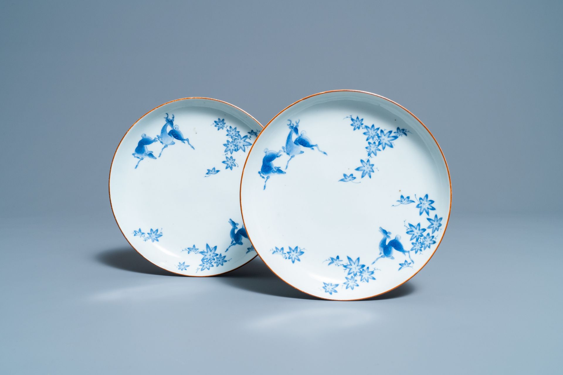 A pair of Japanese Arita blue and white Kakiemon-style 'deer' plates, Edo, 17/18th C.