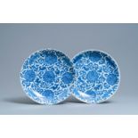 A pair of Chinese blue and white 'lotus scroll' chargers, Kangxi