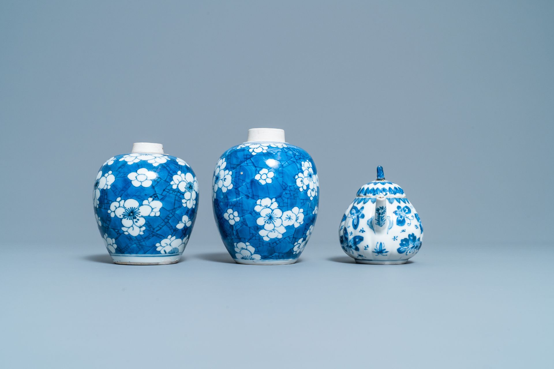 A pair of Chinese blue & white 'prunus' jars & a 'butterfly' teapot & cover, Kangxi - Image 6 of 8