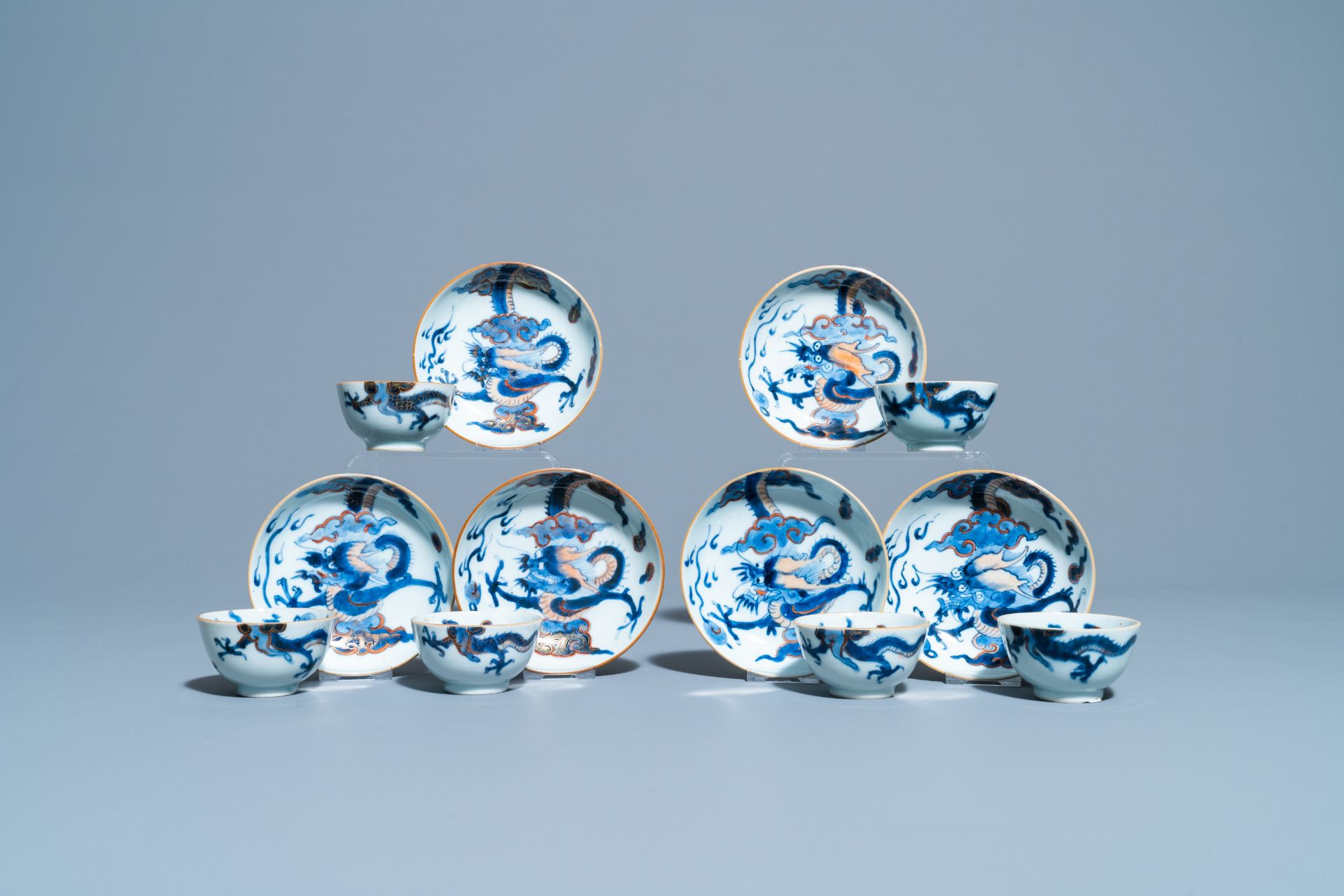 Six Chinese doucai 'dragon' cups and saucers, Kangxi