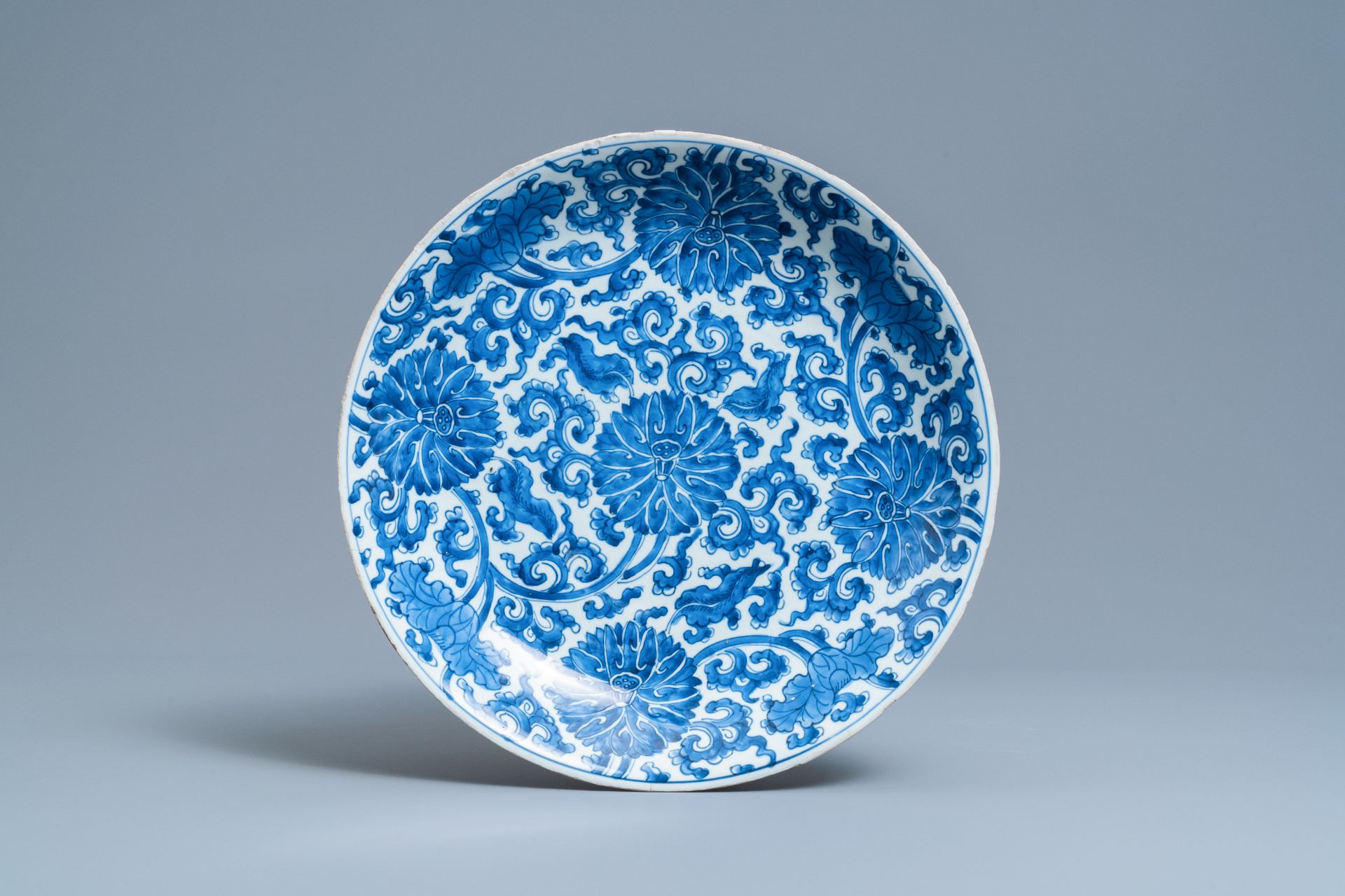 A pair of Chinese blue and white 'lotus scroll' chargers, Kangxi - Image 3 of 5