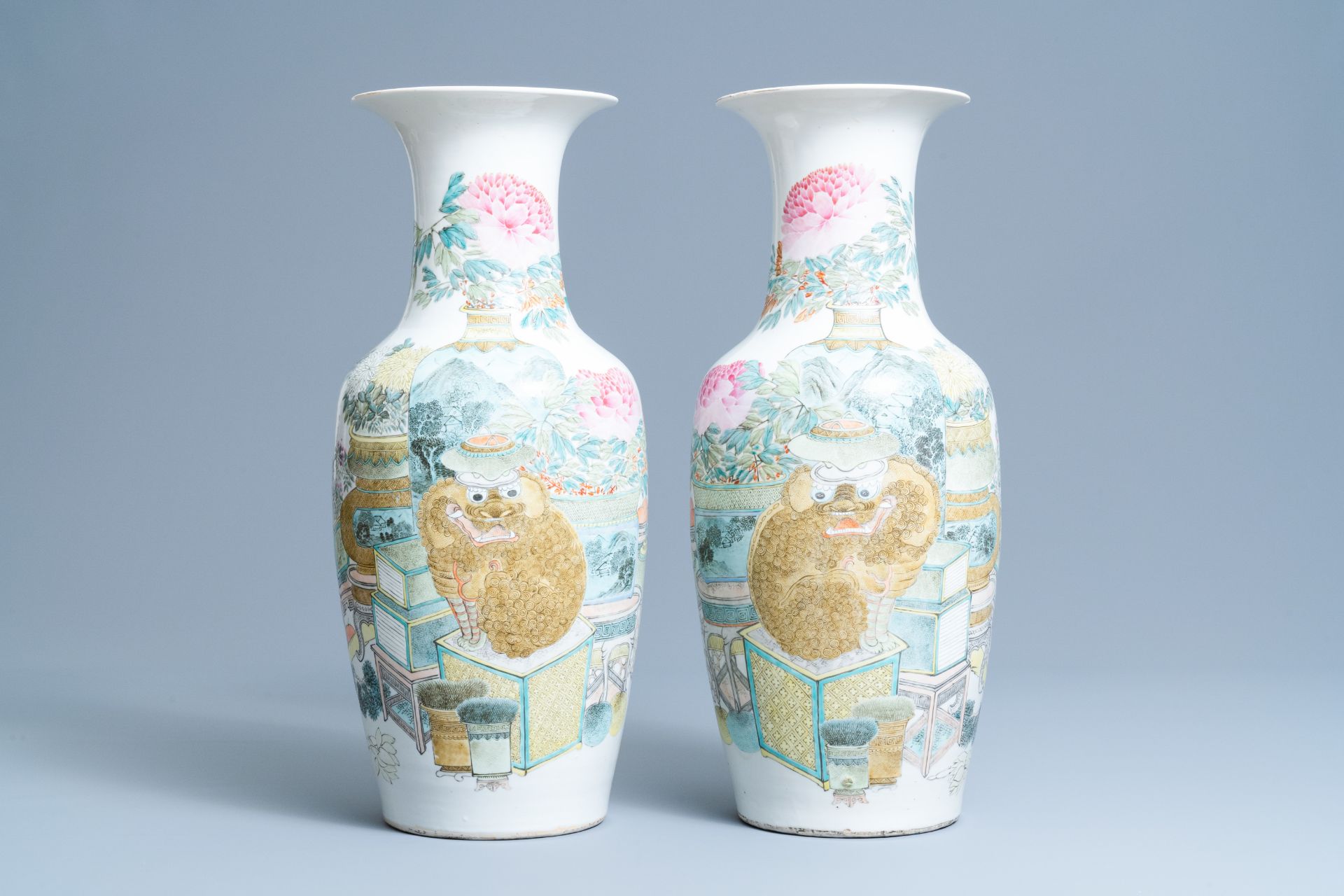 A pair of Chinese qianjiang cai vases with antiquities and buddhist lions, 19/20th C.