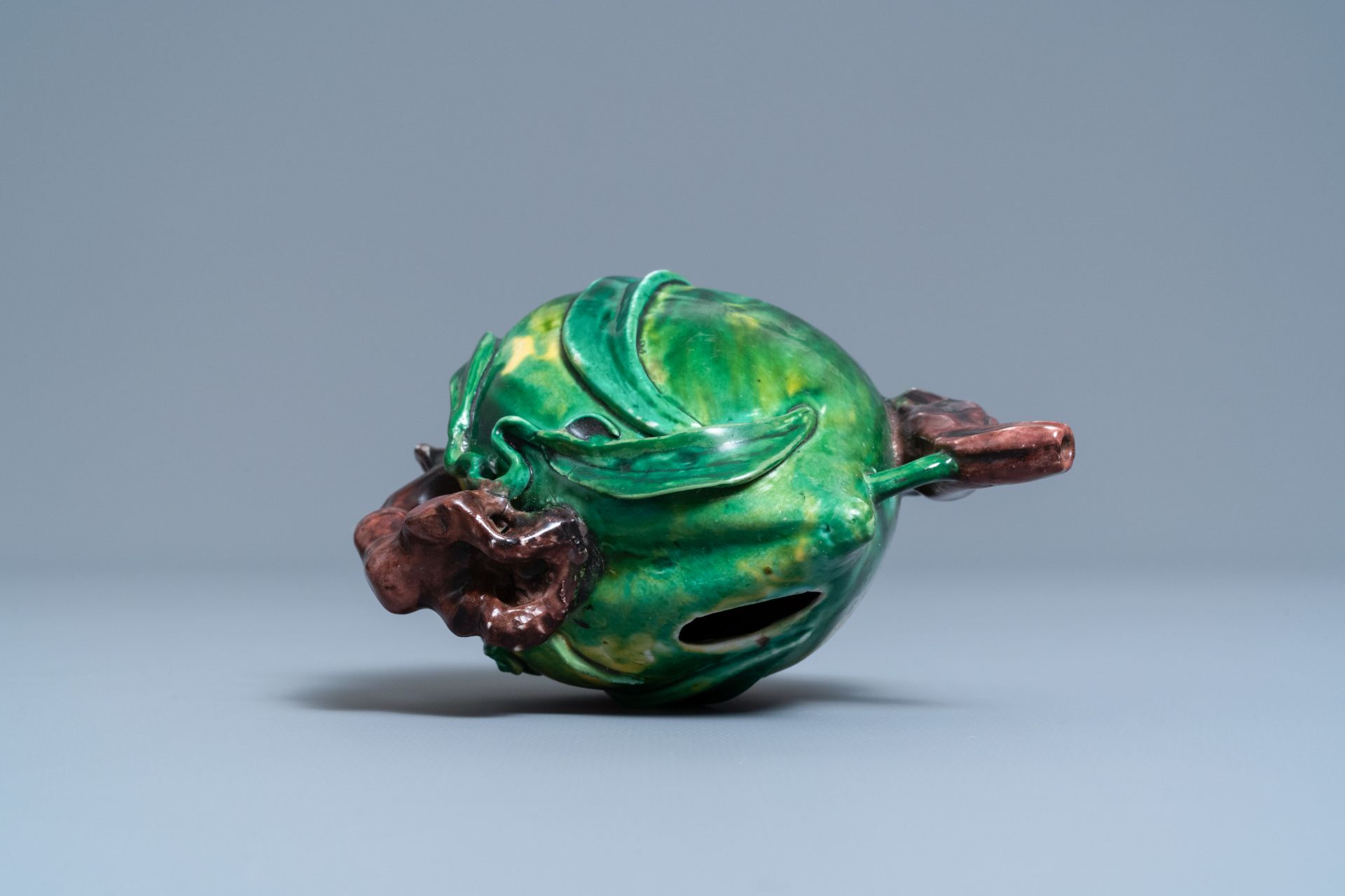 A Chinese verte biscuit peach-shaped 'cadogan' teapot, Kangxi - Image 6 of 7