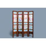 A Chinese wooden four-fold screen with famillle rose plaques, 19th C.