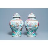 A pair of Chinese famille rose vases and covers, Qianlong mark, 19th C.